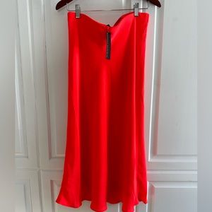 Banana republic neon coral bias cut midi skirt women’s size small.